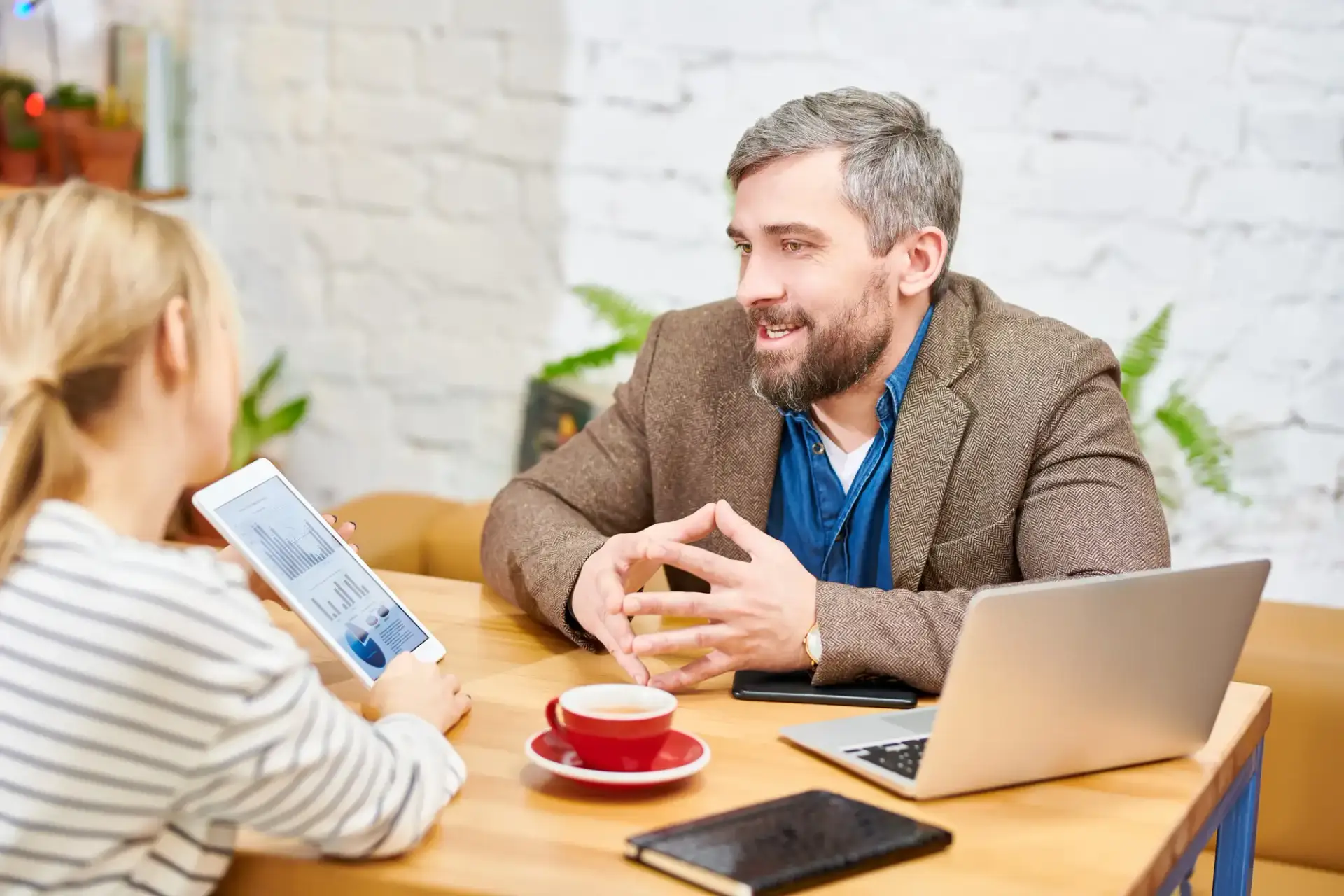 AGE advisors helping a new business owner with entity selection and system setup.