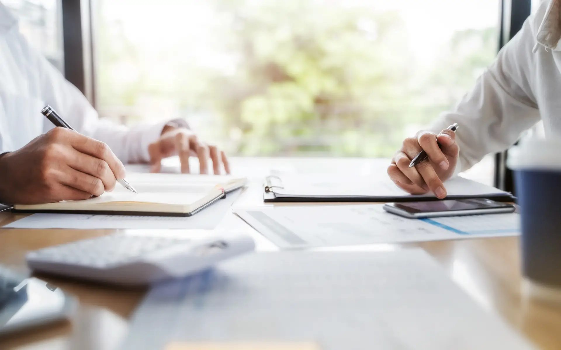 Fractional CFO & Advisory Firm Leadership team calculating business valuation and financial strategy